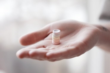 handing pills